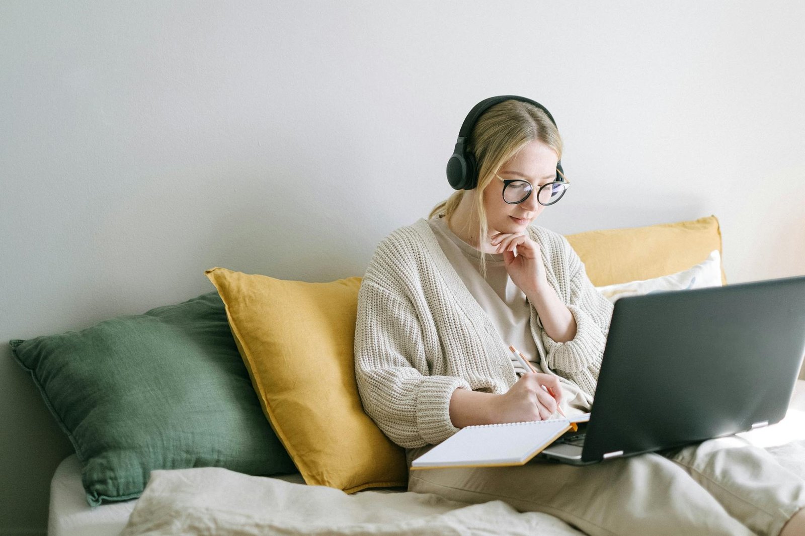 photo of woman taking notes